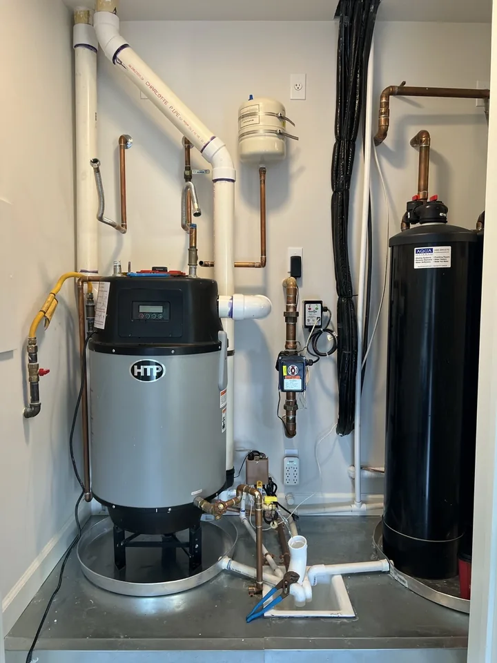 Hybrid water heater and water softener filling a utility closet before the upgrade